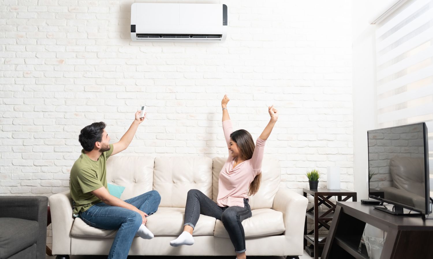 happy homeowners enjoying new mini split ductless air conditioning